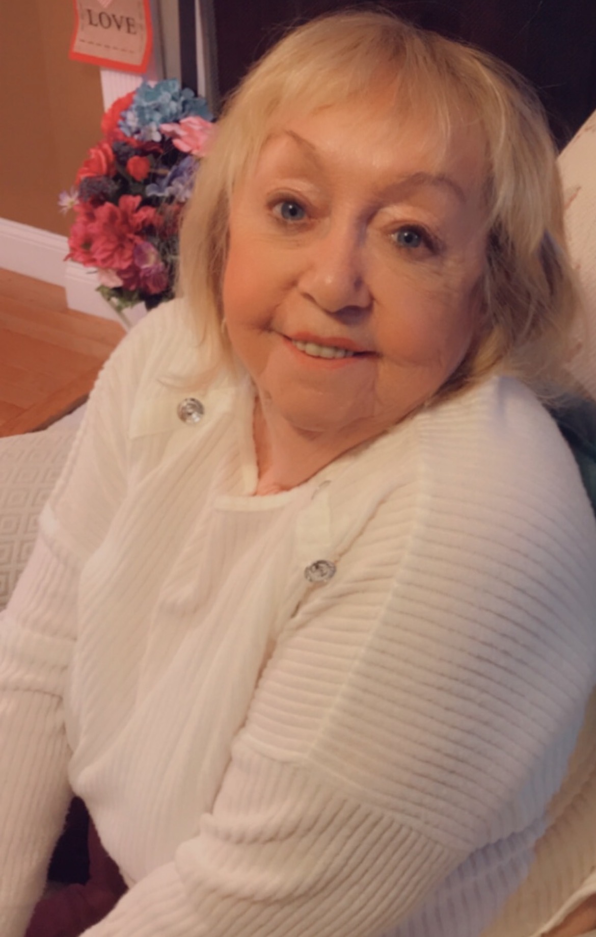 Carol Landry smiling at home