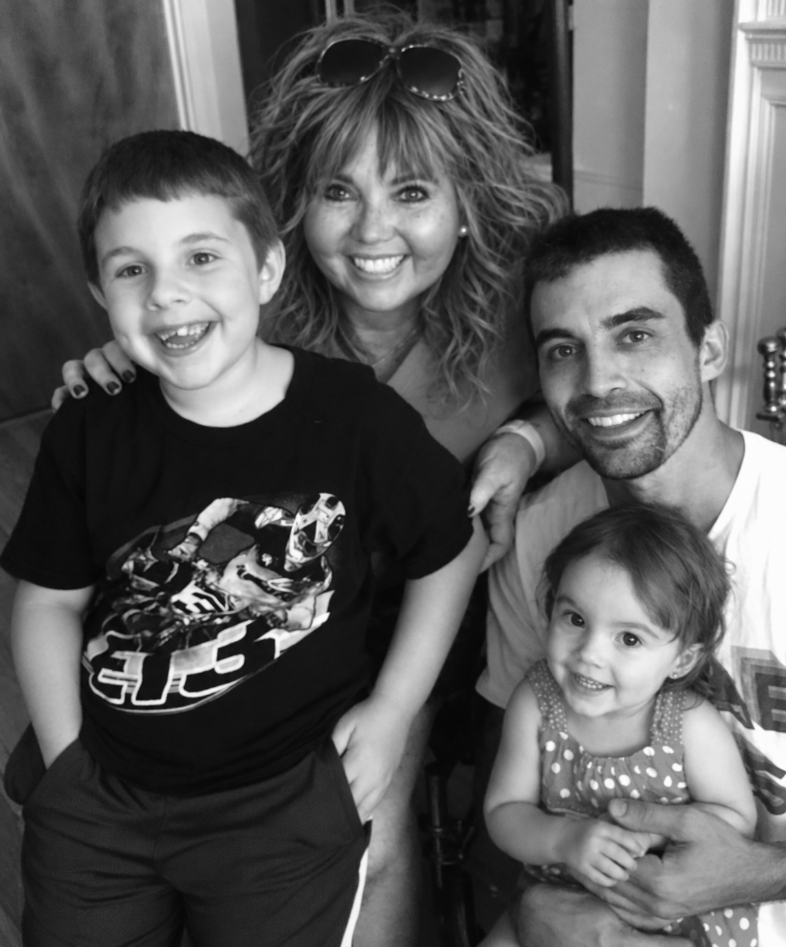 Anne smiling with family members